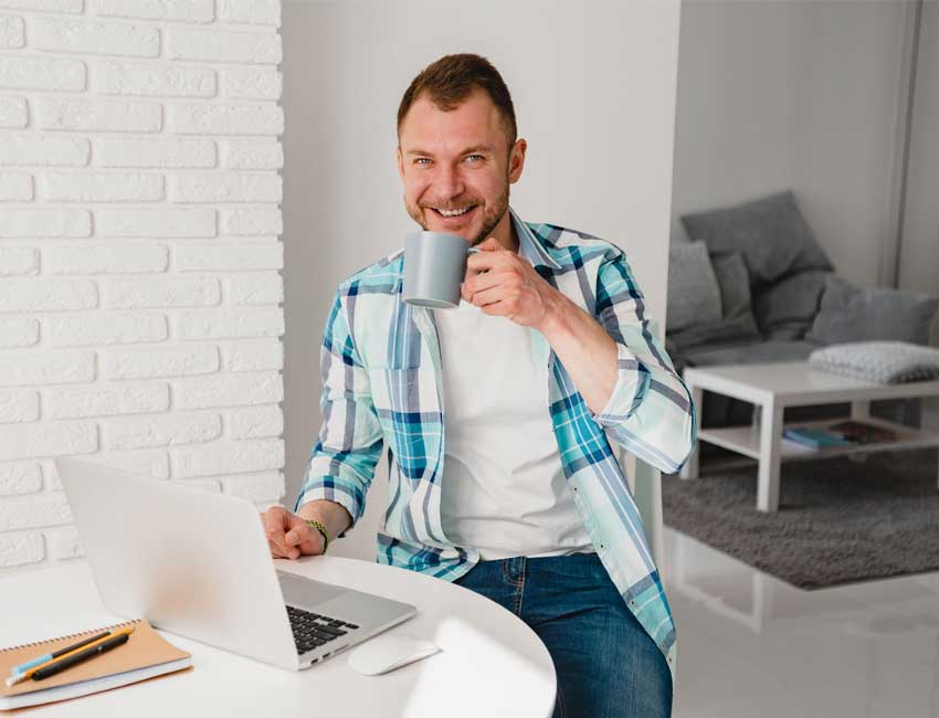 Image of a man in front of a laptop, featuring A+ Revenue Cycle Training and highlighting skill boosters for professional development.